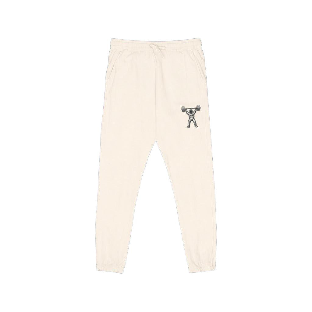 Beige sweatpants with a small graphic on a white background